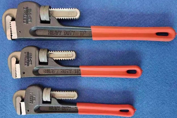 A series of heavy-duty straight pipe wrenches.