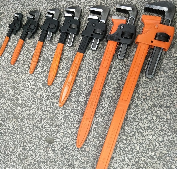 Adjustable steel pipe wrenches.